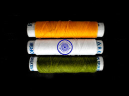 Three rolls of thread, green, white, orange, symbolising the Indian flag